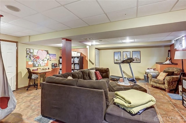 1061 Dapple Ct, Fairborn, OH 45324 - living room featuring a drop ceiling, stairs, baseboards, and light tile patterned floors
