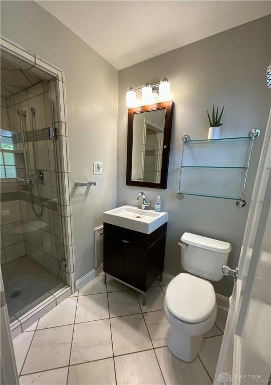 869 Maxwelton, Washington Twp, OH 45459 - bathroom with a shower stall, vanity, toilet, baseboards, and tile patterned flooring