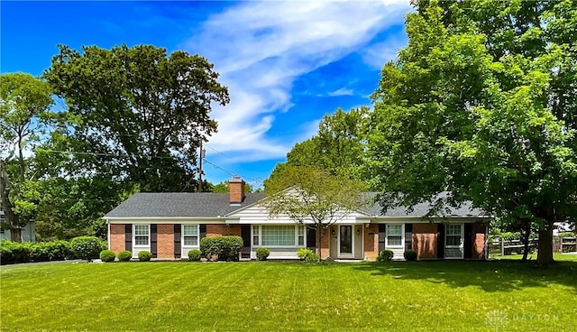 869 Maxwelton, Washington Twp, OH 45459 - ranch-style home with brick siding, a front yard, and a chimney