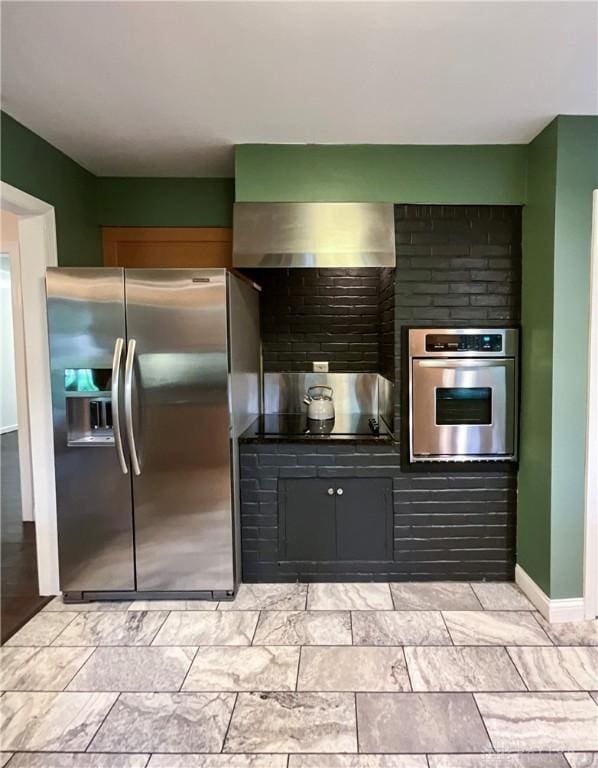 869 Maxwelton, Washington Twp, OH 45459 - kitchen featuring stainless steel appliances, baseboards, and wall chimney exhaust hood