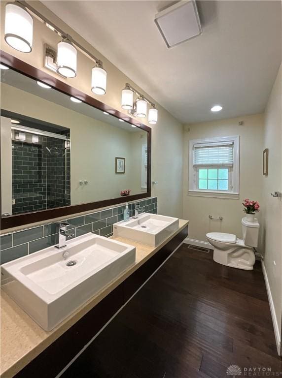 869 Maxwelton, Washington Twp, OH 45459 - full bath featuring toilet, wood finished floors, a shower stall, tasteful backsplash, and baseboards