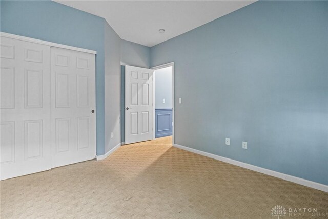 325 Bending Branch Ln, Miamisburg, OH 45342 - unfurnished bedroom with carpet, a closet, and baseboards