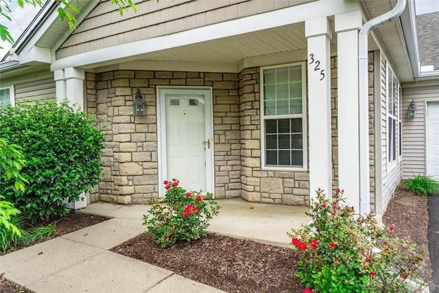 325 Bending Branch Ln, Miamisburg, OH 45342 - doorway to property featuring stone siding and covered porch