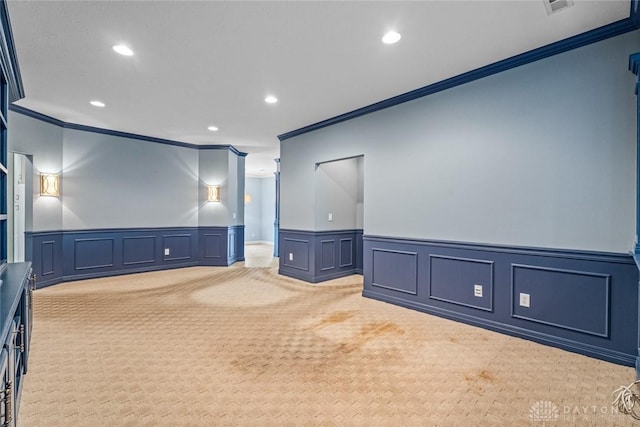 325 Bending Branch Ln, Miamisburg, OH 45342 - cinema room with crown molding, a decorative wall, a wainscoted wall, recessed lighting, and light carpet