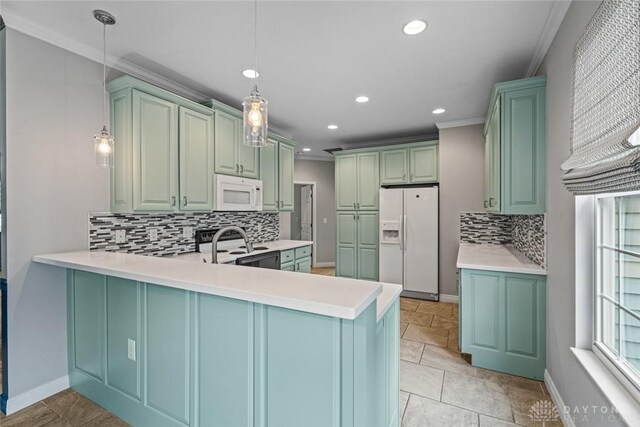 325 Bending Branch Ln, Miamisburg, OH 45342 - kitchen featuring white appliances, crown molding, recessed lighting, decorative backsplash, and a peninsula
