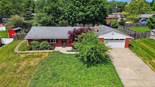 6123 Millbrook Dr, Washington Twp, OH 45459 - view of front facade with brick siding, driveway, and an attached garage