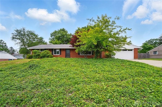 6123 Millbrook Dr, Washington Twp, OH 45459 - ranch-style home featuring concrete driveway, an attached garage, brick siding, and a front lawn