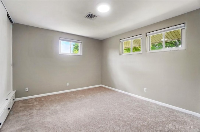 6123 Millbrook Dr, Washington Twp, OH 45459 - empty room with healthy amount of natural light, light colored carpet, and baseboards