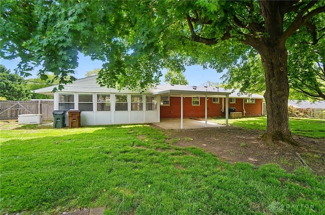 6123 Millbrook Dr, Washington Twp, OH 45459 - back of house with a patio area, a sunroom, and brick siding
