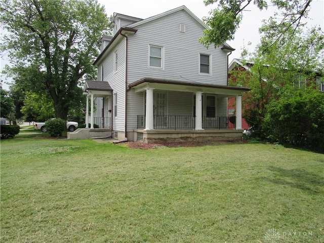 2455 Catalpa Dr, Dayton, OH 45406 - view of front facade with covered porch and a front lawn