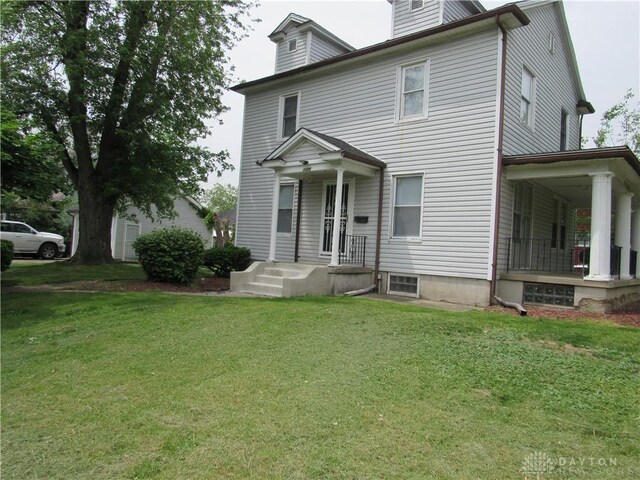 2455 Catalpa Dr, Dayton, OH 45406 - american foursquare style home with a front lawn, a porch, and a chimney