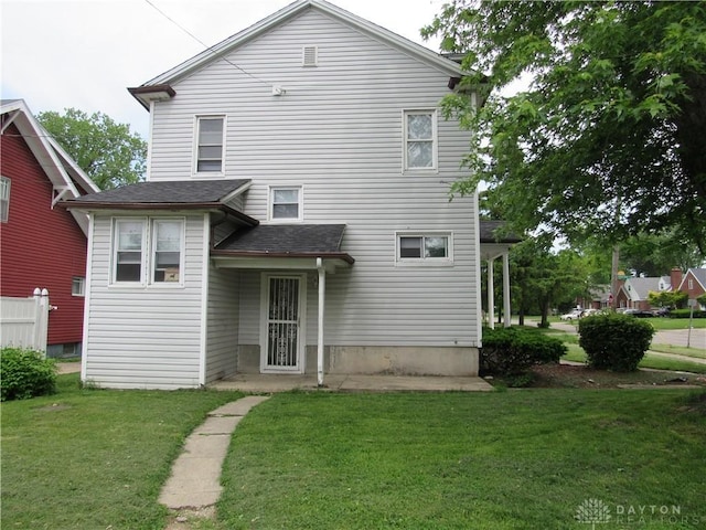 2455 Catalpa Dr, Dayton, OH 45406 - back of property featuring a yard and a shingled roof