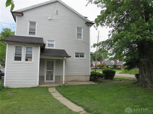 2455 Catalpa Dr, Dayton, OH 45406 - rear view of house featuring a yard