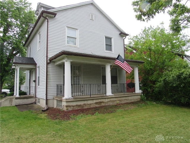 2455 Catalpa Dr, Dayton, OH 45406 - view of front of house with covered porch and a front yard