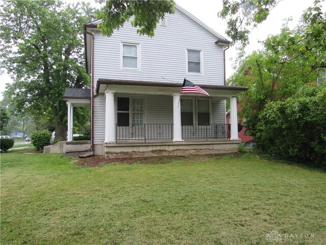 2455 Catalpa Dr, Dayton, OH 45406 - view of front of property featuring covered porch and a front yard