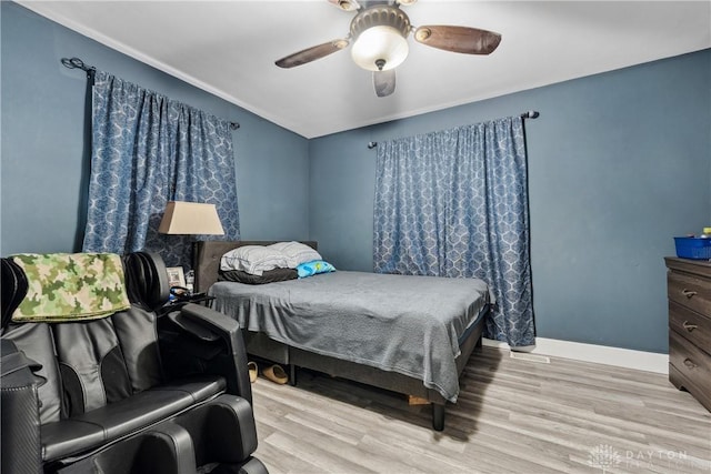 2819 Mccall St, Dayton, OH 45417 - bedroom with wood finished floors, ceiling fan, and baseboards