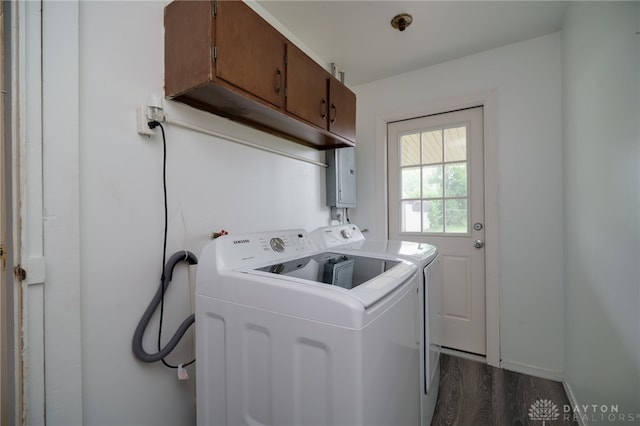 1115 Richard Dr, Xenia, OH 45385 - washroom featuring cabinet space, dark wood finished floors, independent washer and dryer, and electric panel