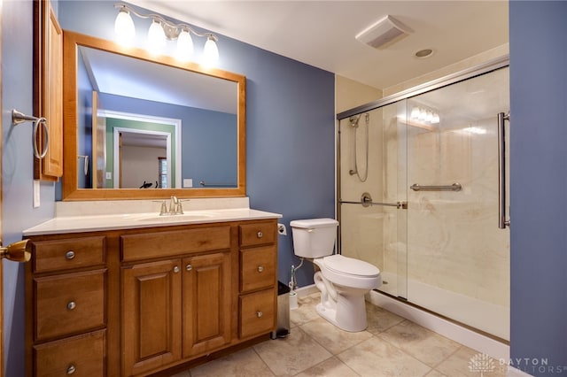 1252 Harmony Ln, Fairborn, OH 45324 - full bath featuring toilet, vanity, a shower stall, tile patterned floors, and baseboards