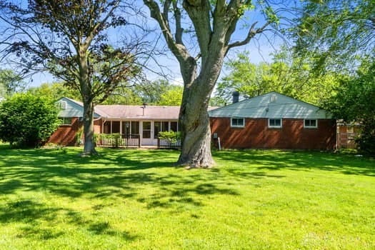 1108 Donson Dr, Kettering, OH 45429 - back of property with a sunroom and a yard