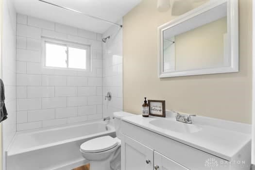 1108 Donson Dr, Kettering, OH 45429 - bathroom with vanity, toilet, and  shower combination