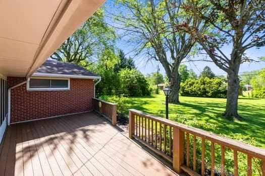 1108 Donson Dr, Kettering, OH 45429 - wooden deck featuring a lawn