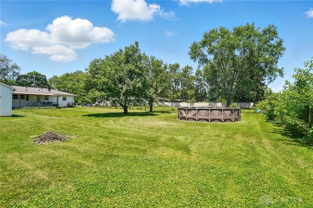 6726 Middletown Germantown Rd, Middletown, OH 45042 - view of green lawn with an outdoor pool
