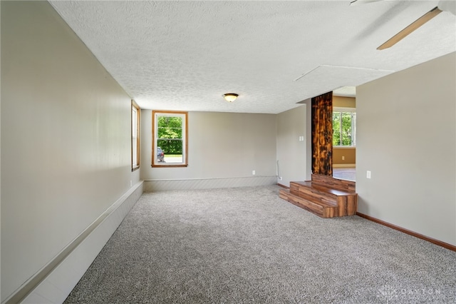 6726 Middletown Germantown Rd, Middletown, OH 45042 - carpeted empty room with a textured ceiling, plenty of natural light, a ceiling fan, and baseboards
