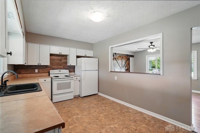 6726 Middletown Germantown Rd, Middletown, OH 45042 - kitchen featuring white appliances, a sink, light countertops, white cabinets, and a textured ceiling