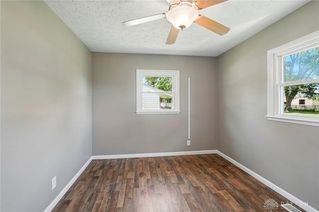 6726 Middletown Germantown Rd, Middletown, OH 45042 - spare room with plenty of natural light, baseboards, dark wood-style flooring, and a textured ceiling
