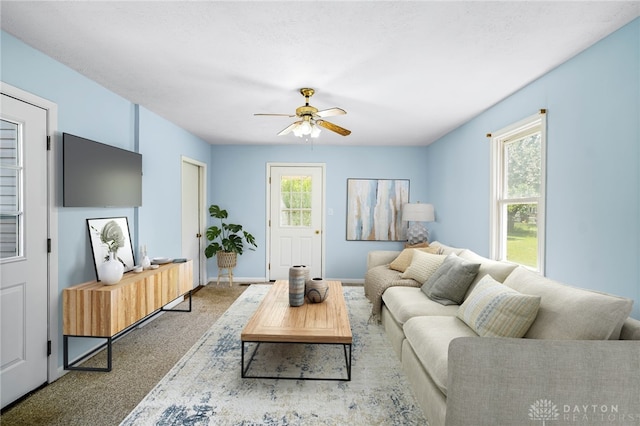 1385 Kylemore Dr, Xenia, OH 45385 - living room with a ceiling fan, carpet flooring, and baseboards