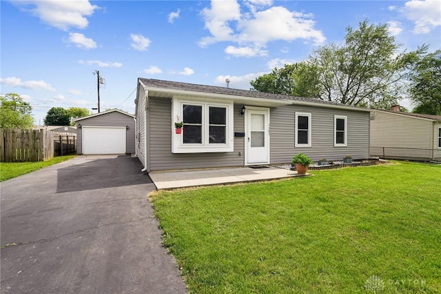 1385 Kylemore Dr, Xenia, OH 45385 - view of front facade with a detached garage, an outbuilding, and driveway