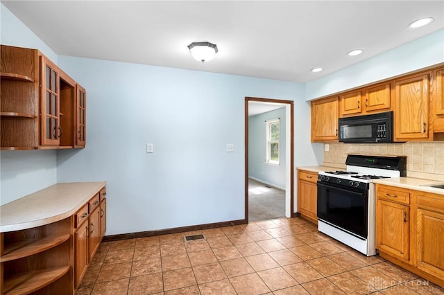 1385 Kylemore Dr, Xenia, OH 45385 - kitchen featuring black microwave, gas range oven, open shelves, light countertops, and recessed lighting
