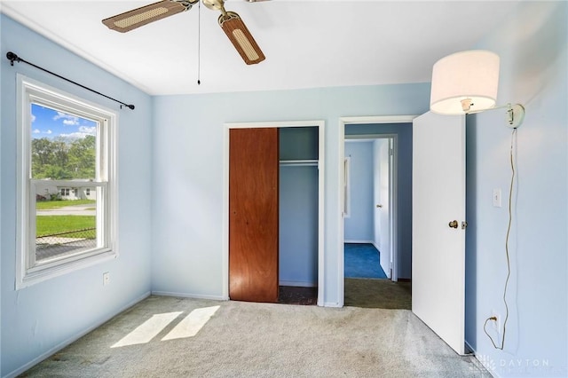 1385 Kylemore Dr, Xenia, OH 45385 - unfurnished bedroom with carpet floors, a closet, ceiling fan, and baseboards
