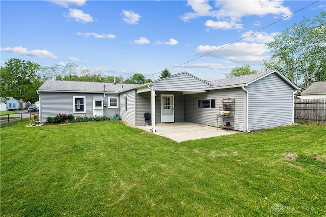 1385 Kylemore Dr, Xenia, OH 45385 - back of house with a patio area and roof with shingles