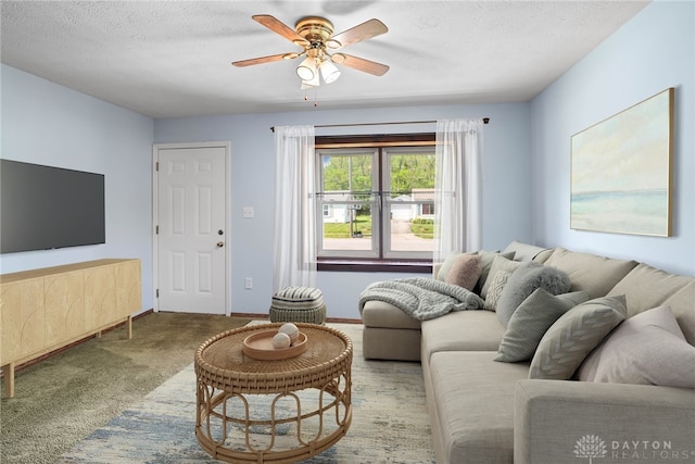 1385 Kylemore Dr, Xenia, OH 45385 - carpeted living area featuring ceiling fan, a textured ceiling, and baseboards
