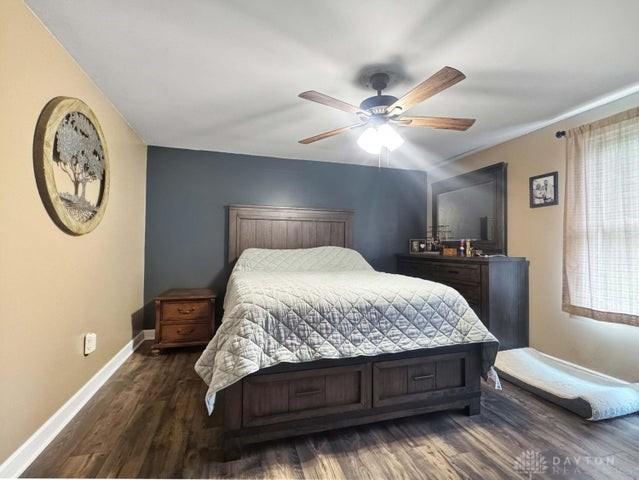 1277 Yocom Rd, Cable, OH 43009 - bedroom with dark wood-style floors, baseboards, and ceiling fan