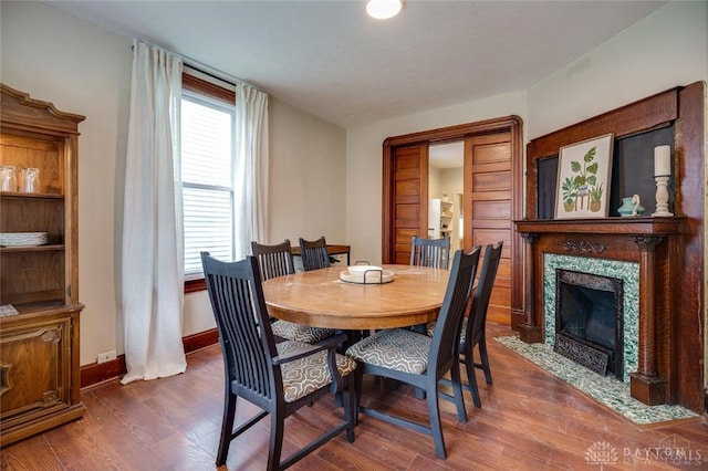 519 Prytania Ave, Hamilton, OH 45013 - dining space featuring wood finished floors, baseboards, and a high end fireplace