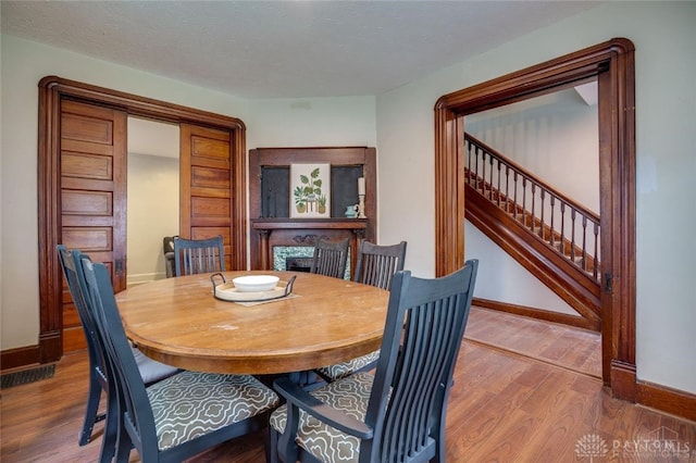 519 Prytania Ave, Hamilton, OH 45013 - dining room with wood finished floors, stairs, and baseboards