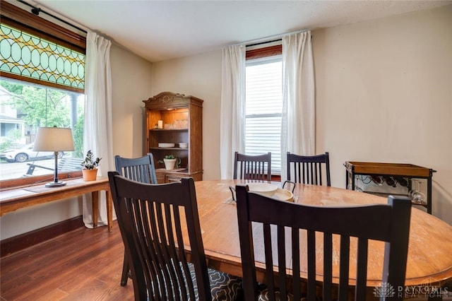 519 Prytania Ave, Hamilton, OH 45013 - dining room featuring wood finished floors, healthy amount of natural light, and baseboards