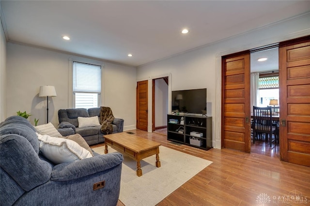 519 Prytania Ave, Hamilton, OH 45013 - living room featuring crown molding, recessed lighting, light wood-style floors, and baseboards