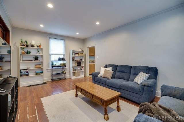 519 Prytania Ave, Hamilton, OH 45013 - living room with ornamental molding, dark wood finished floors, recessed lighting, and baseboards