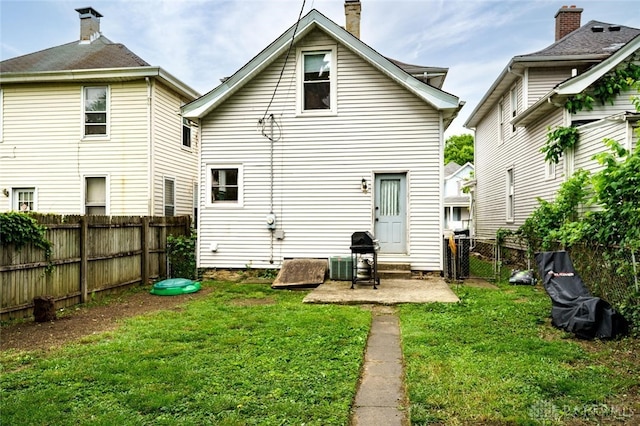 519 Prytania Ave, Hamilton, OH 45013 - rear view of house featuring a chimney and a patio area