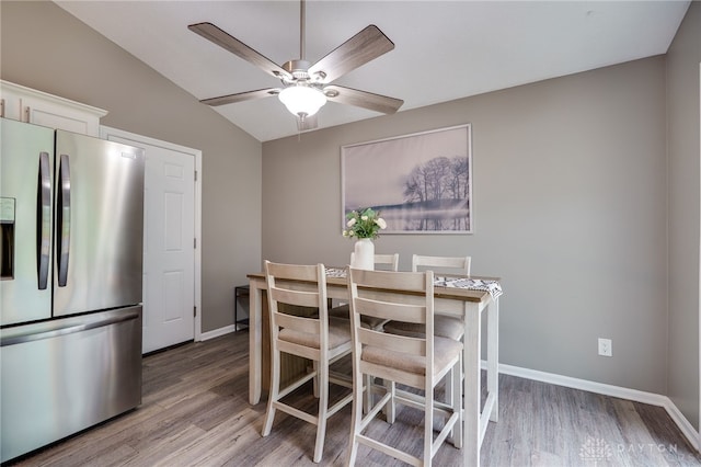 866 Trenton Rd, Trenton, OH 45067 - dining room with light wood finished floors, ceiling fan, baseboards, and lofted ceiling