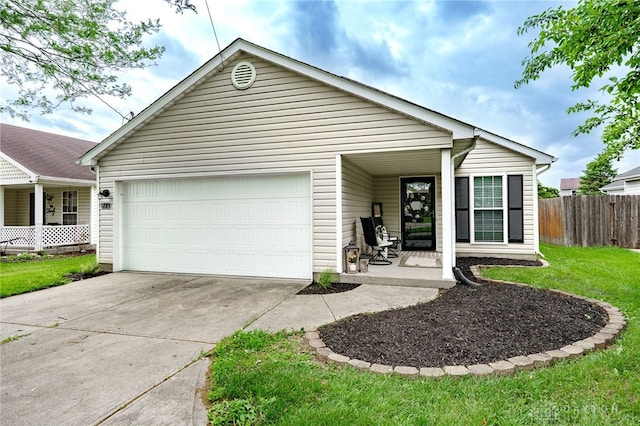 866 Trenton Rd, Trenton, OH 45067 - view of front facade featuring a garage, concrete driveway, and covered porch
