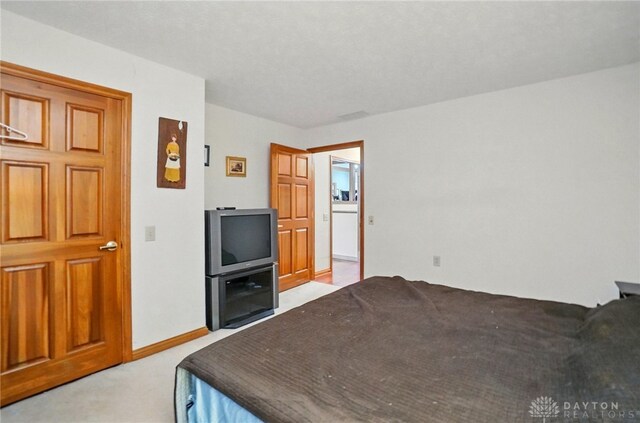 1403 Timshel St, Sugarcreek Township, OH 45440 - bedroom featuring light carpet and baseboards