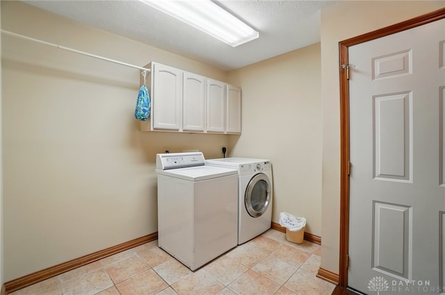 1403 Timshel St, Sugarcreek Township, OH 45440 - washroom featuring washing machine and clothes dryer, baseboards, and cabinet space
