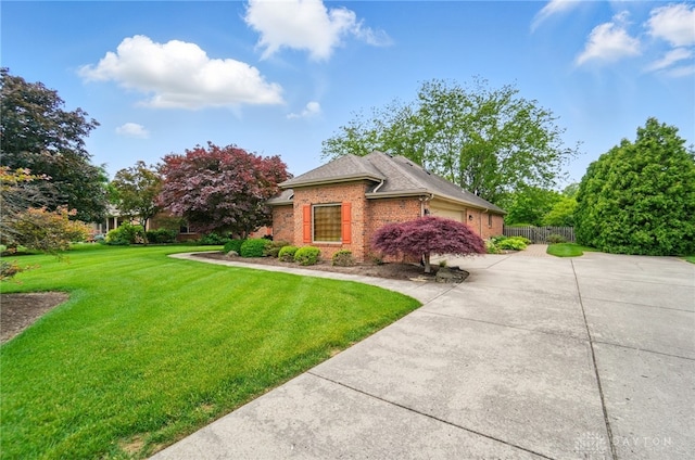1403 Timshel St, Sugarcreek Township, OH 45440 - view of front facade featuring concrete driveway, brick siding, and an attached garage