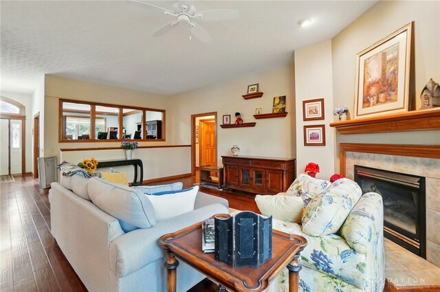 1403 Timshel St, Sugarcreek Township, OH 45440 - living room with ceiling fan, wood finished floors, and a fireplace