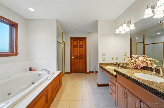 1403 Timshel St, Sugarcreek Township, OH 45440 - full bath with a shower stall, double vanity, a whirlpool tub, baseboards, and tile patterned floors