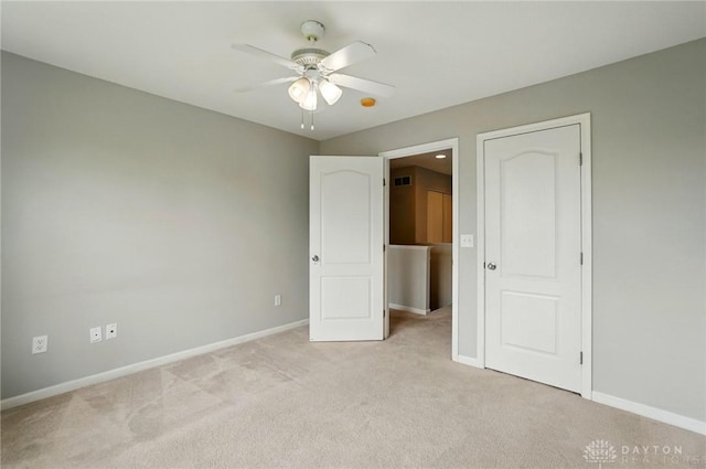 9235 Great Lakes Cir, Washington Twp, OH 45458 - unfurnished bedroom featuring baseboards, light colored carpet, and ceiling fan
